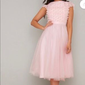 Pink dress with flower appliqués